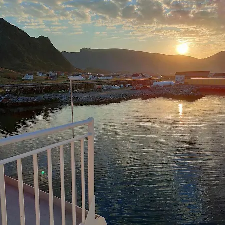 House On Beautiful Vaeroy, Mountains And Sea Outside The Window