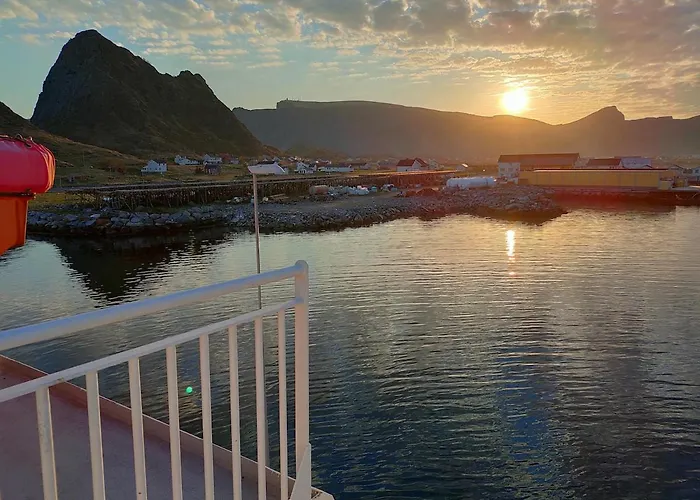 House On Beautiful Vaeroy, Mountains And Sea Outside The Window
